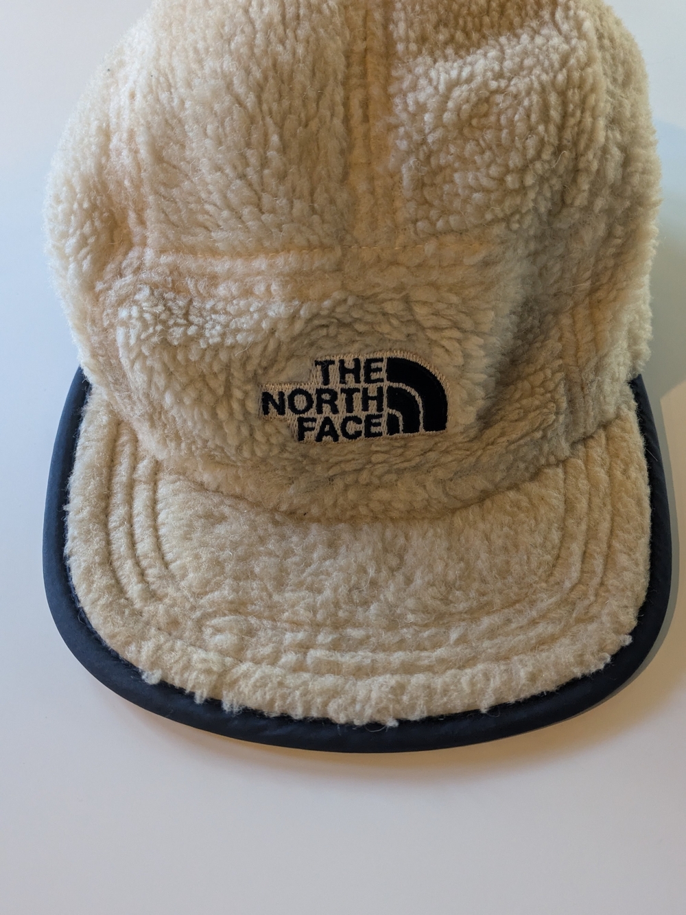 The North Face Reversible Fleece Nylon Camp Cap Cream Navy